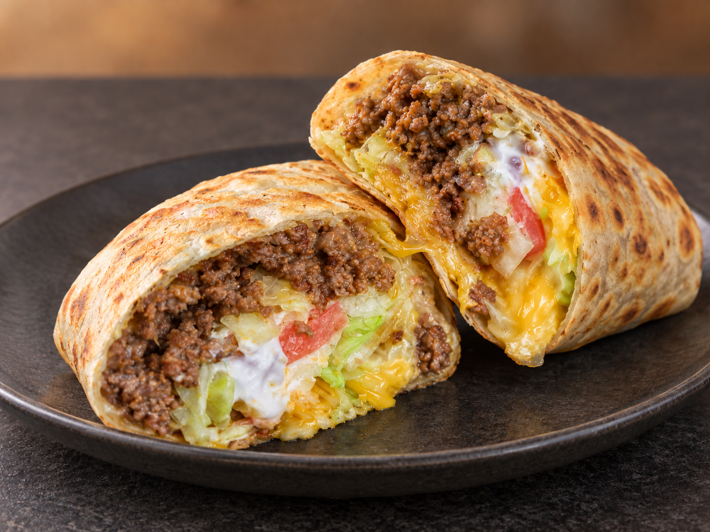 Toasted wrap with beef, cheese, and vegetables